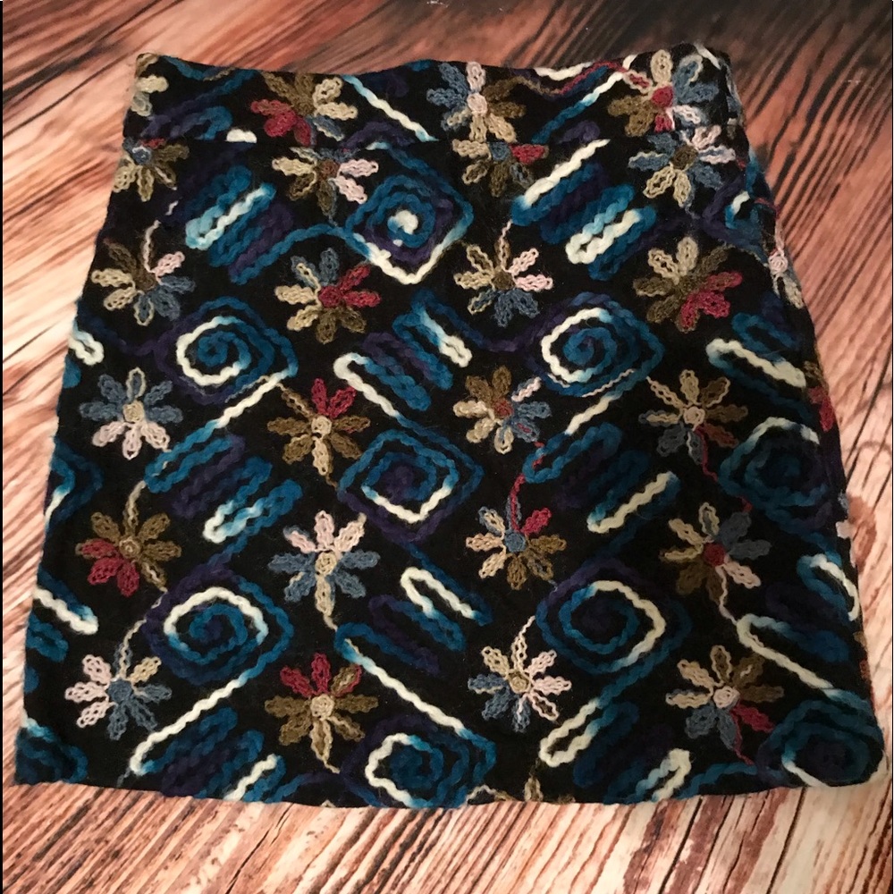 short skirt with hand-embroidered details.